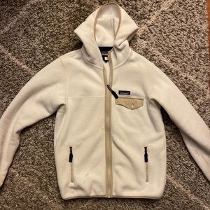 white and tan patagonia fleece zip up